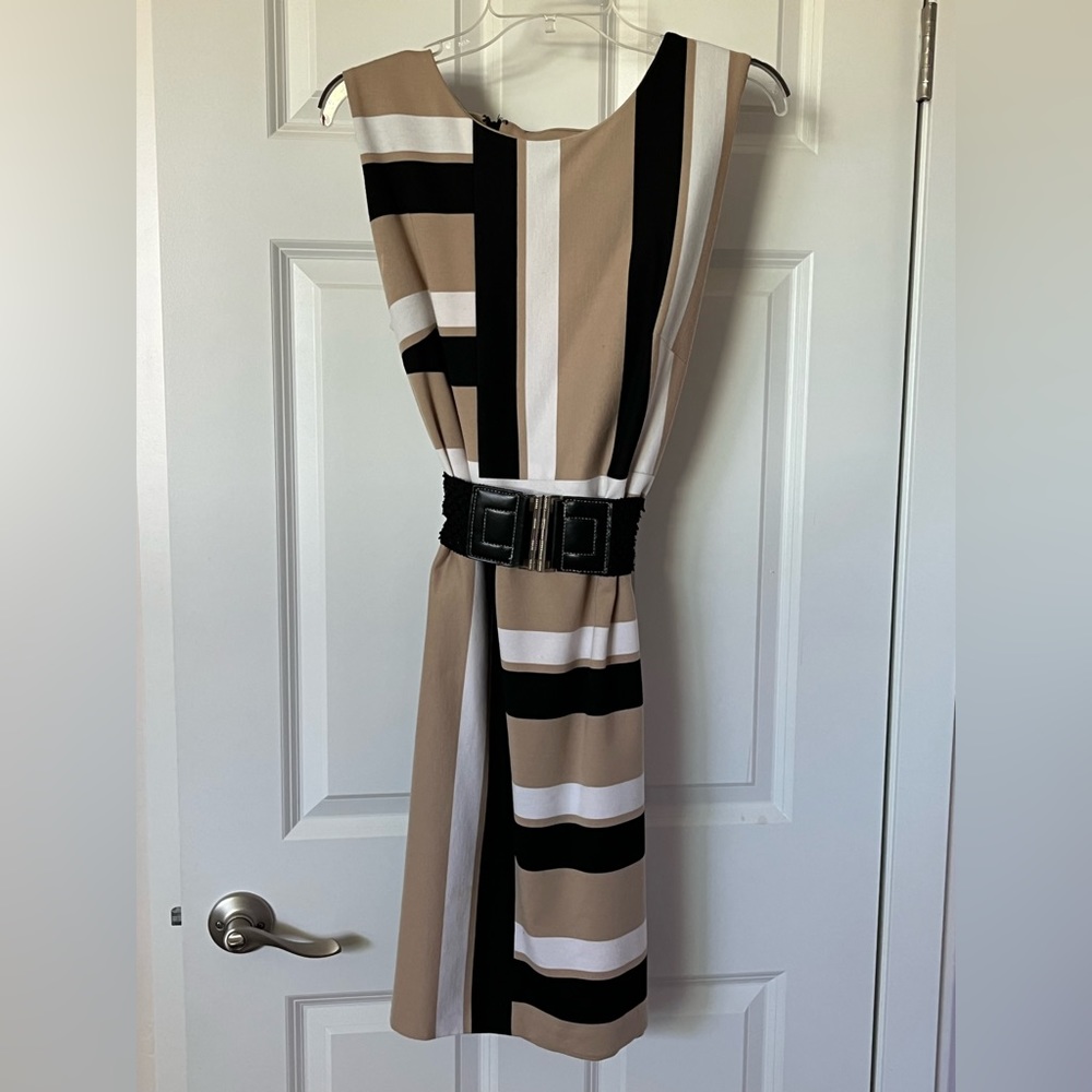 Cute work dress then out to dinner with a change of shoes. Worn once. Size 14.
